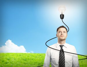 Man with lightbulb hanging over his head